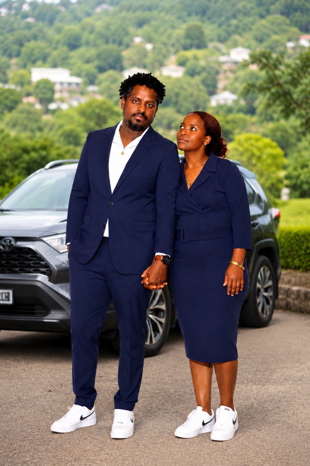 Couple portrait outdoors near a vehicle